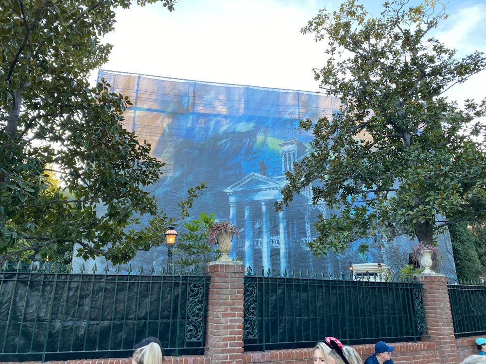 haunted mansion construction scrims disneyland 3.jpg?auto=compress%2Cformat&fit=scale&h=750&ixlib=php 1.2