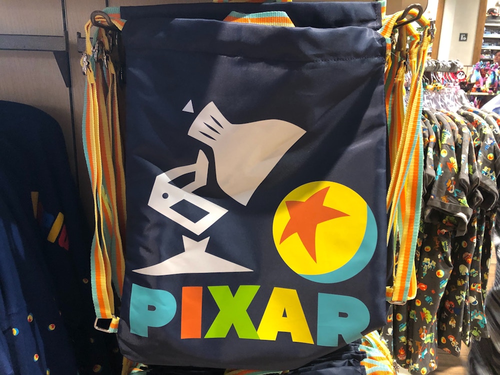 world of pixar disney springs drawstring bag 1.jpg?auto=compress%2Cformat&fit=scale&h=750&ixlib=php 1.2