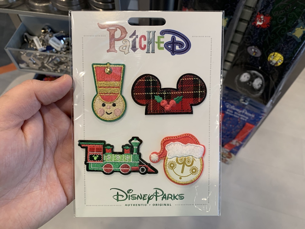 01 021120 Epcot Christmas Patches Pin Traders.jpeg?auto=compress%2Cformat&fit=scale&h=750&ixlib=php 1.2