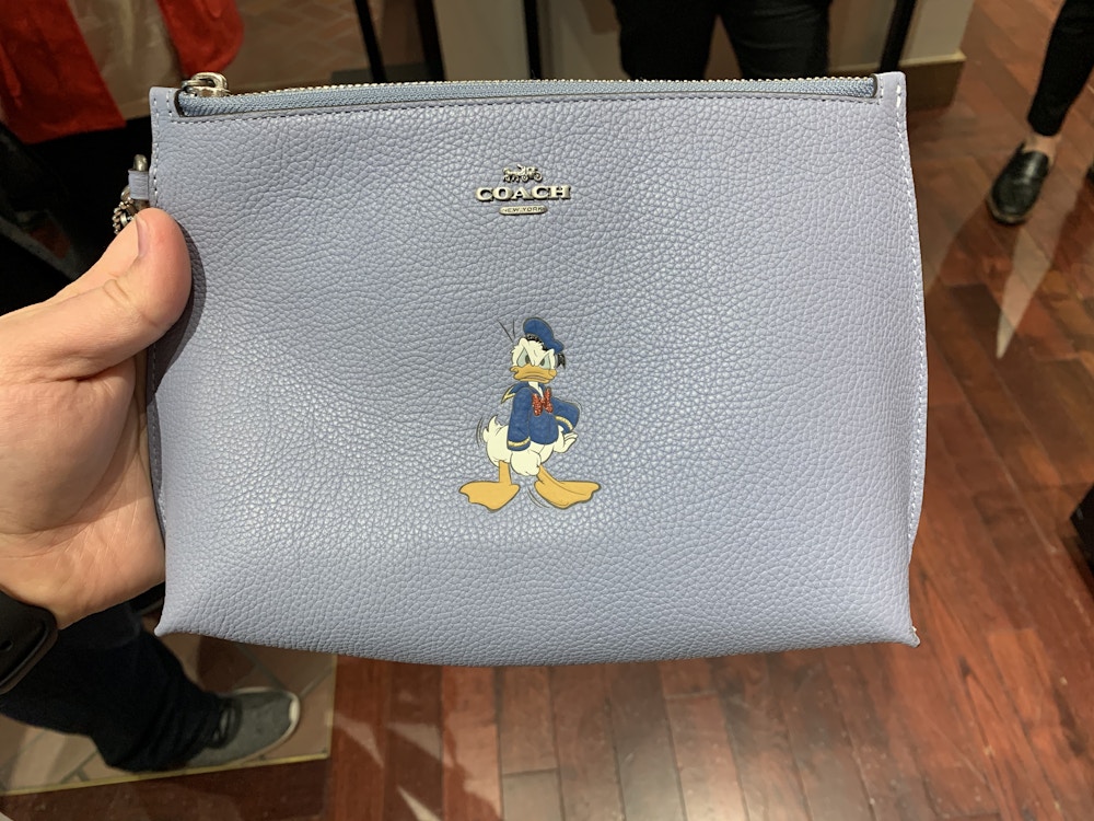 06 020120 Disney Springs Coach Collection Donald Front 2.jpeg?auto=compress%2Cformat&fit=scale&h=750&ixlib=php 1.2