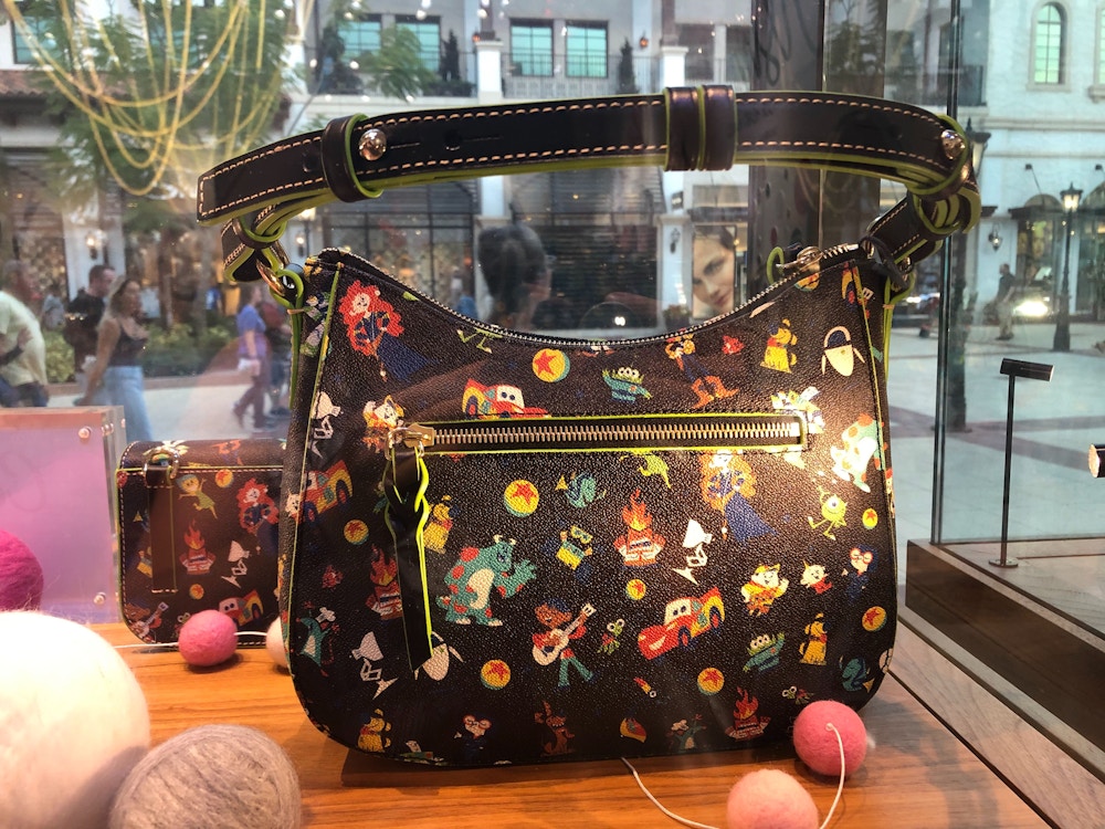 Dooney and Bourke World of Pixar Preview Disney Springs Feb2020 3.jpg?auto=compress%2Cformat&fit=scale&h=750&ixlib=php 1.2