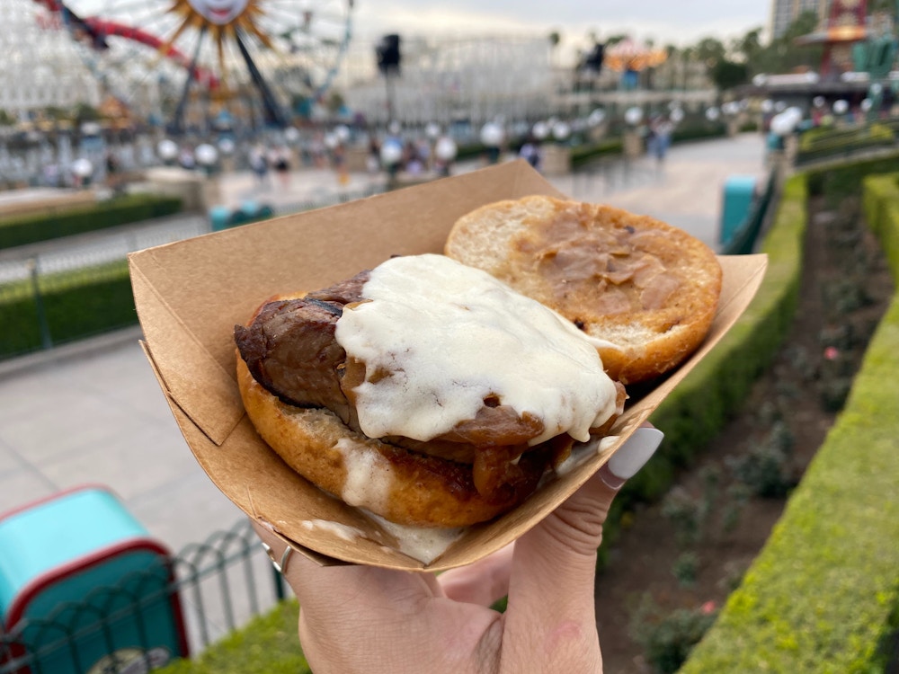 cluck a doodle moo 2020 disney california adventure food wine festival beef tenderloin slider 1.jpg?auto=compress%2Cformat&fit=scale&h=750&ixlib=php 1.2