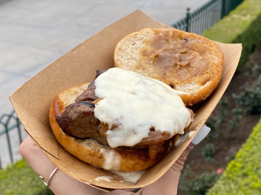 cluck a doodle moo 2020 disney california adventure food wine festival beef tenderloin slider 3.jpg?auto=compress%2Cformat&fit=scale&h=750&ixlib=php 1.2