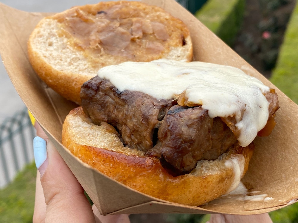 cluck a doodle moo 2020 disney california adventure food wine festival beef tenderloin slider 4.jpg?auto=compress%2Cformat&fit=scale&h=750&ixlib=php 1.2