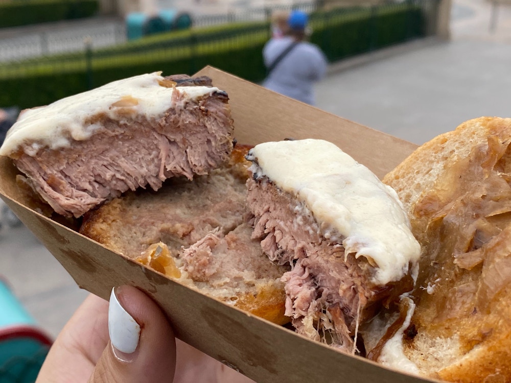 cluck a doodle moo 2020 disney california adventure food wine festival beef tenderloin slider 6.jpg?auto=compress%2Cformat&fit=scale&h=750&ixlib=php 1.2