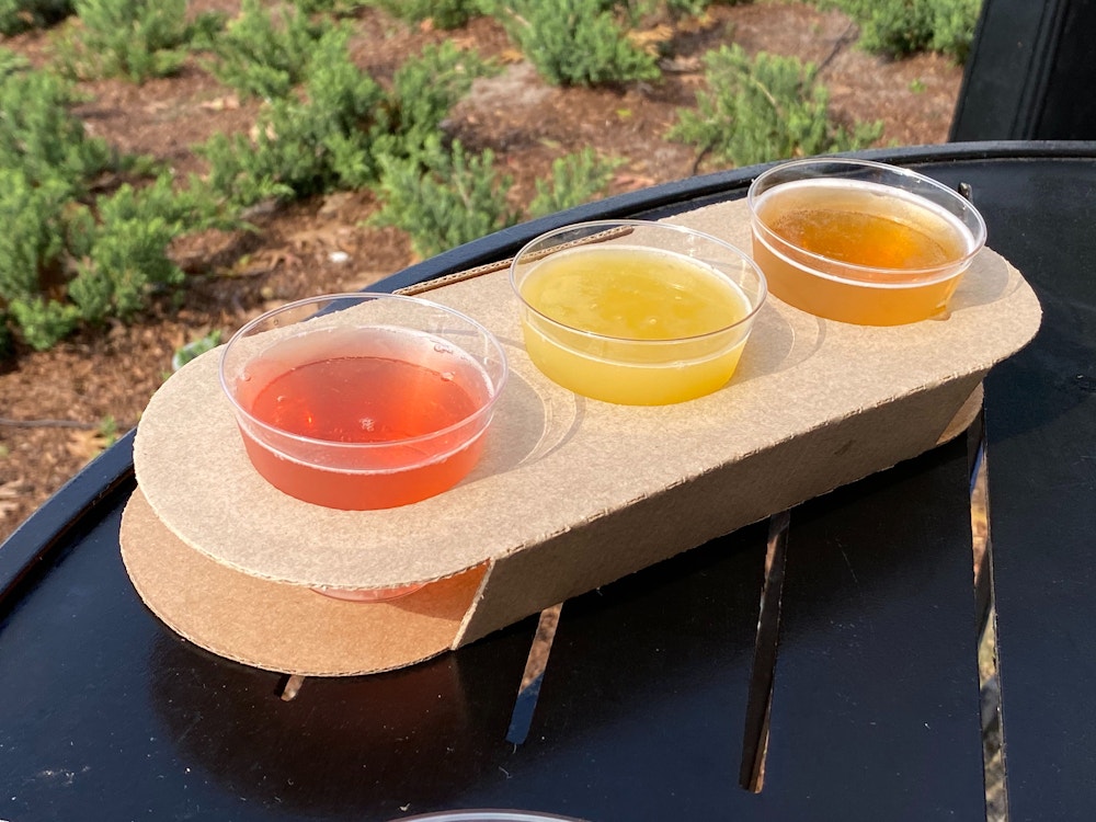 beer flight refreshment outpost 2020 epcot international flower garden festival 1.jpg?auto=compress%2Cformat&fit=scale&h=750&ixlib=php 1.2