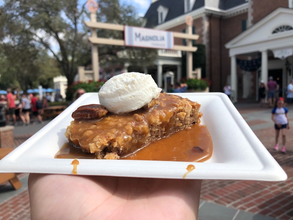 pecan cake magnolia terrace 2020 epcot international flower garden festival 1.jpg?auto=compress%2Cformat&fit=scale&h=750&ixlib=php 1.2