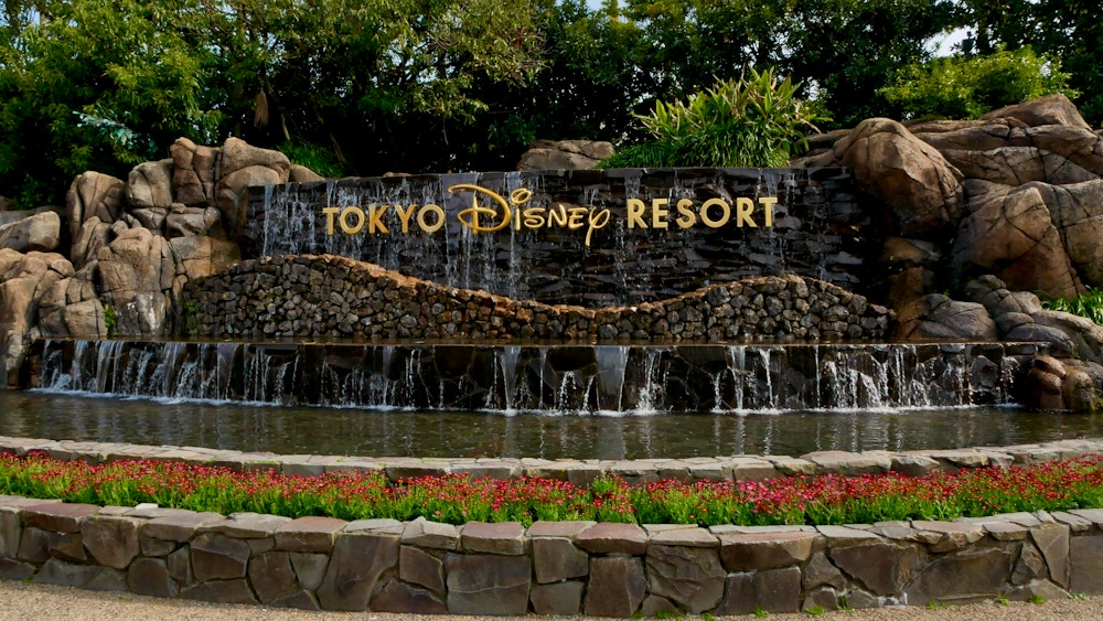 Tokyo Disney Waterfall.jpeg?auto=compress%2Cformat&fit=scale&h=563&ixlib=php 1.2
